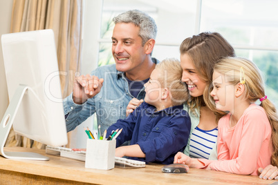 Happy family using the computer