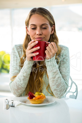 Young girl drink her coffee