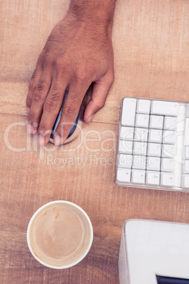 Businessman using mouse while working