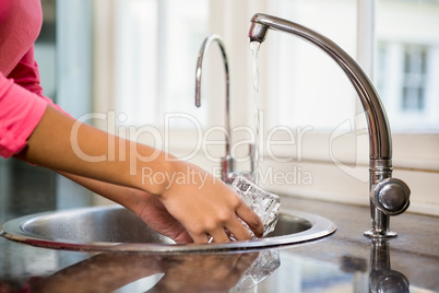 Close up of woman washing glass