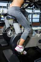 Mid section of woman doing bike exercise