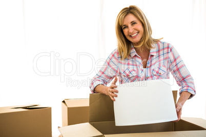 Woman opening a box