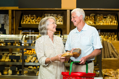 Senior couple buying bread