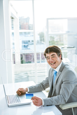 Asian businessman holding a business card