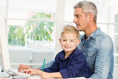 Father and son at the desk