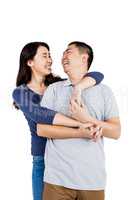 Cheerful woman embracing man