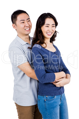 Man embracing woman