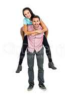 Smiling man giving piggy back to his girlfriend