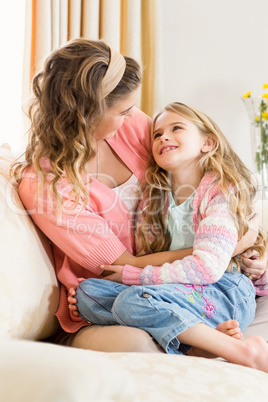 Mother and daughter smiling together