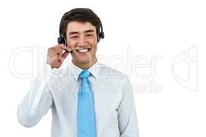 Smiling asian businessman using headset