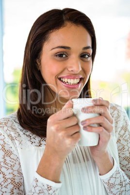 Young girl drink her tea