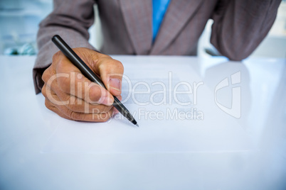 Serious businessman on his desk