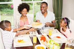 Happy family eating together