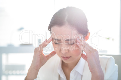 Stressed businesswoman working at her desk