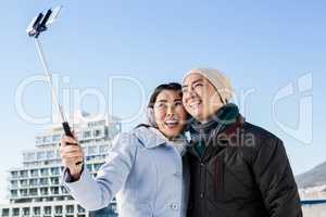 Smiling couple taking selfie