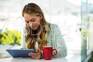 Girl with her tablet smiling