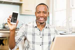 Smiling man showing smartphone screen