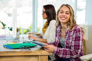 Two girls use a computer