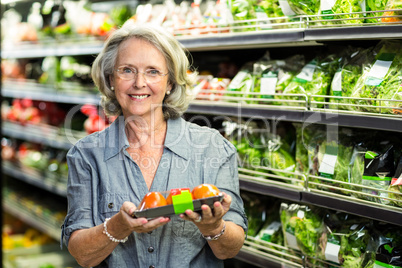 Senior woman picking out some vegetables