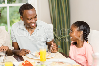 Happy family enjoying their meal