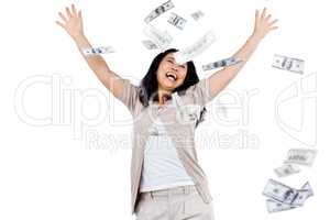 Smiling woman throwing money around