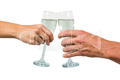 Cropped hand of couple holding champagne flute