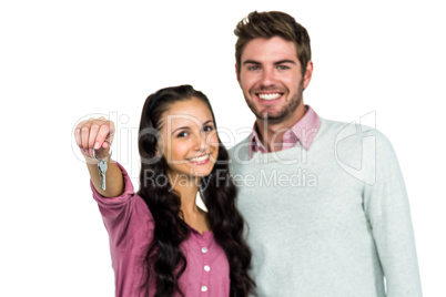 Portrait of happy couple holding keys