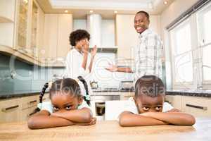 Sad siblings against parents arguing
