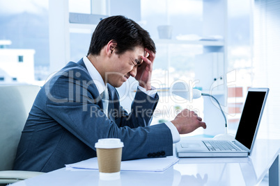 Businessman having a headache