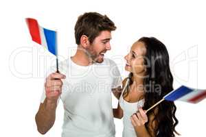 Happy couple holding French flag
