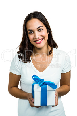 Portrait of young woman holding gift box