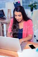 Beautiful businesswoman using laptop