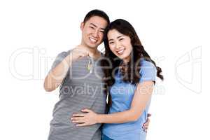 Portrait of happy young couple with keys