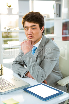 Thoughtful asian businessman