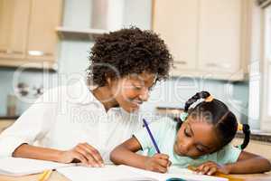 Mother checking daughters homework