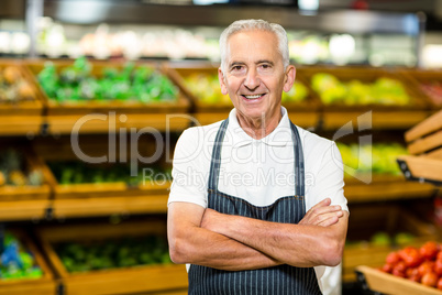 Senior worker with arms crossed