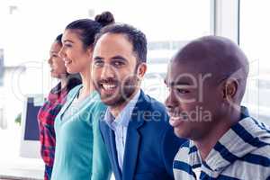 Portrait of smart businessman with colleagues