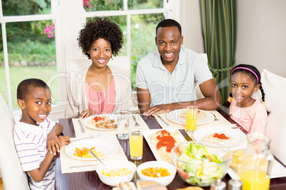 Happy family eating together