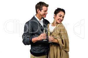 Smiling couple holding wine glasses