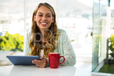 Girl with her tablet smiling