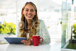 Girl with her tablet smiling