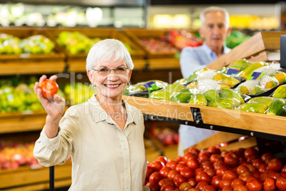 Senior couple buying food at the grocery