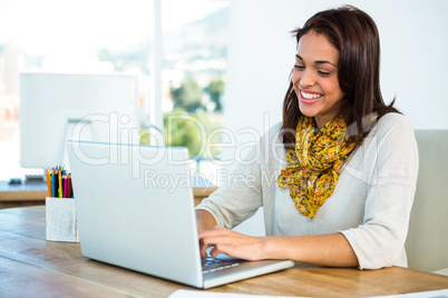 Young girl uses his computer