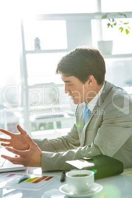 Asian businessman on his desk