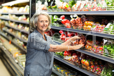 Senior woman picking out some vegetables