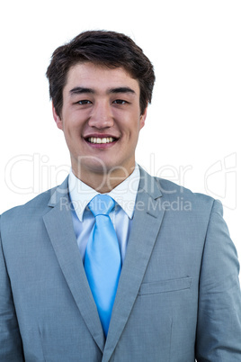 Smiling asian businessman against a white background