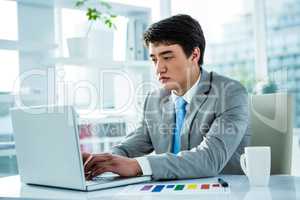 Asian businessman working in his computer