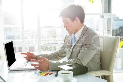 Asian businessman on his desk