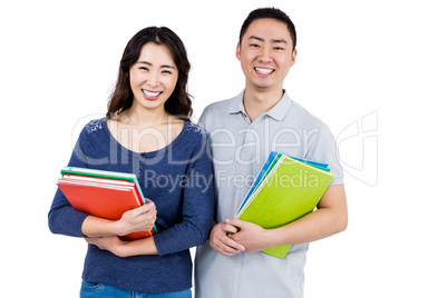 Happy couple holding books