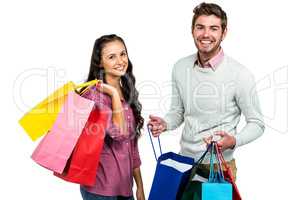 Portrait of happy couple holding shopping bag